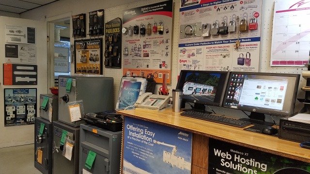 Interstate Security service counter with padlock display wall and Master Lock products